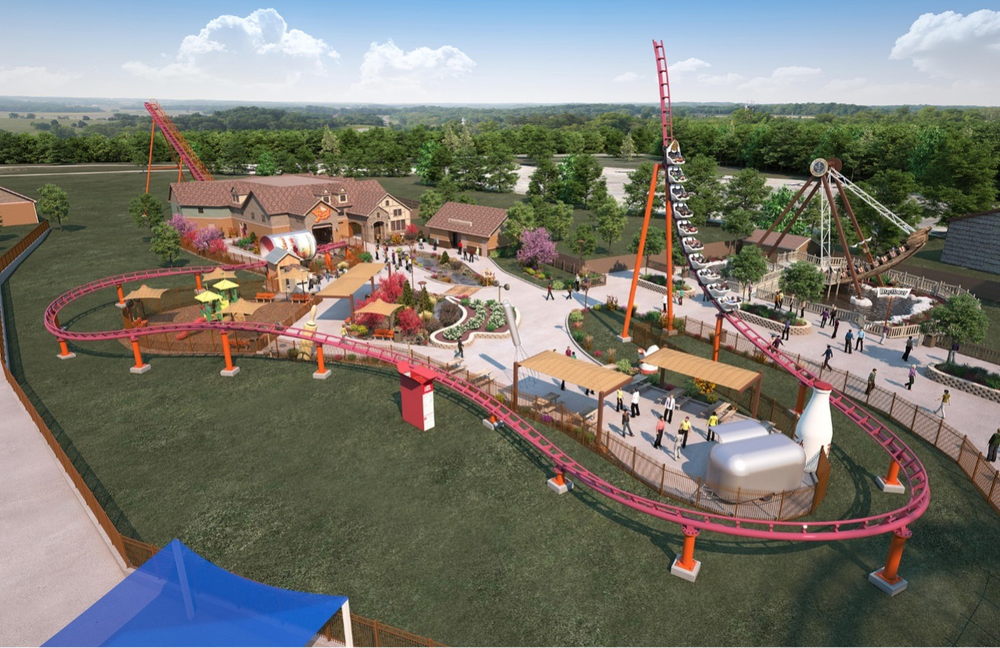 A red roller coaster wraps around giant kitchen items with a plaza in the middle.